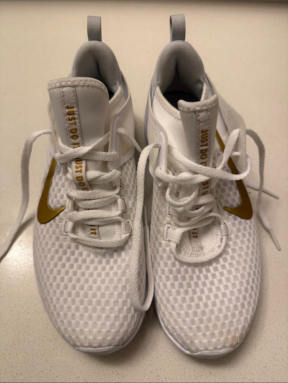 Nike Air Max Bella TR 2 in the White/Pure Platinum/Metallic Gold colorway